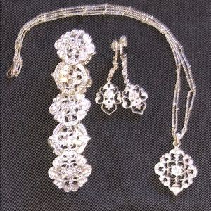 Silver tone filigree jewelry set.